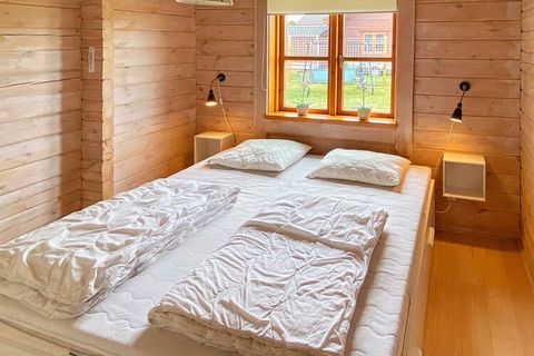 In a quiet area in Marielyst you will find this log house with whirlpool, sauna and various activities. The whole plot is fenced. The house is decorated cozy with modern furniture, open kitchen with i.a. ceramic hobs, extractor hood and dishwasher. T...