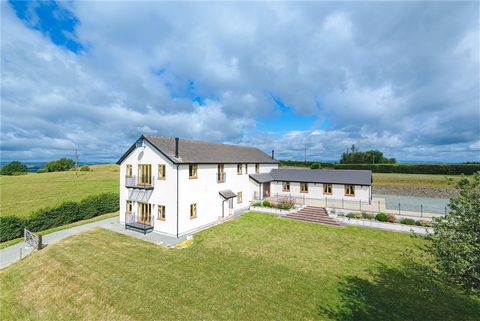 A stunning country residence, which was formerly a stone cottage and barn. It has been vastly adapted, updated and improved to provide a spacious south facing contemporary country home of approximately 4,987 sq ft / 463.2 sq meters. It stands in abou...