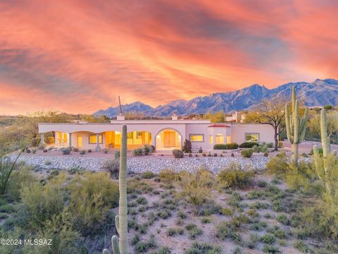 Exclusive gated opportunity in Catalina Foothills Estates #10. Experience breathtaking views of the Tucson skyline and Catalina Foothills vistas. Four bedrooms and bathrooms surround the open concept living space with a wall of picture windows overlo...