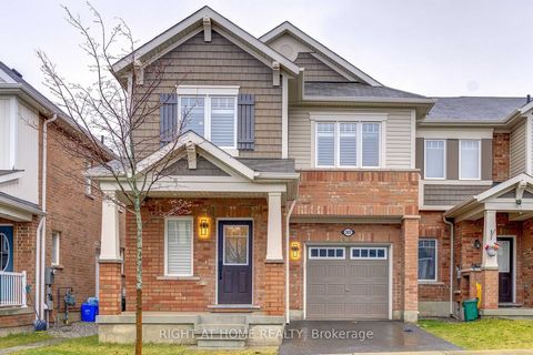 Absolutely! Step into this stunning end unit townhome and experience a flood of natural light that illuminates the modern upgrades throughout. The main floor is an elegant fusion of style and functionality, featuring laminate flooring, oak stairs, an...