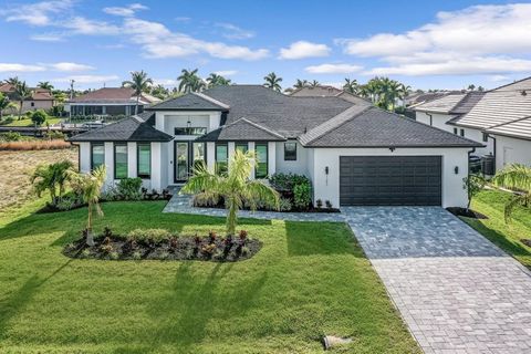 Welcome to this meticulously designed and refreshingly decorated turnkey home in the heart of Cape Coral. Offering a seamless fusion of sophistication and comfort, this residence invites you and your guests to unwind in its spacious living areas. The...
