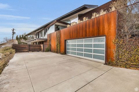Using every inch of this elongated parcel, renowned architect Steve Simmons has truly created your dream home retreat in Salt Lake's Upper Avenues. A double-sided fireplace welcomes you at the front door, leading to a cozy courtyard connecting the ma...