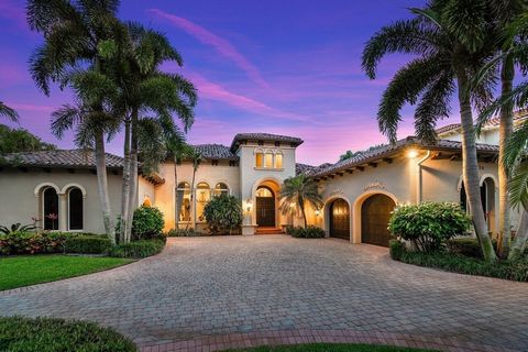 Stunning ranch-style residence with 5 bedrooms and 4.1 bathrooms, fully renovated in 2016, is situated on a generous lakefront property in the exclusive Grand Estates enclave of The Oaks, Boca Raton. This home offers breathtaking lake views, high vau...