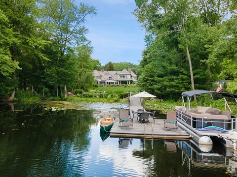 Spectacular Nantucket style waterfront directly on Blue Heron Lake with breathtaking views. This country home is gated, fenced and completely private with truly beautiful land, gardens and fabulous dock, pool and pool house. Blue Heron is a private, ...