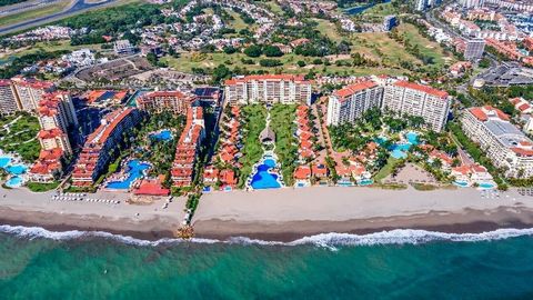 Discover luxury living at its finest in this beachfront condo nestled in Marina Vallarta, one of PV's most coveted areas. Boasting beachfront access, indulge in the serenity of the ocean with a pristine infinity pool and private restaurant at your fi...