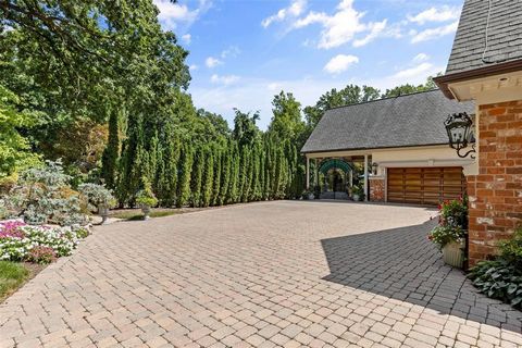 The pinnacle of luxurious living w/nearly 13,000 sq ft of living space, this captivating home is in harmony w/the botanical gardens & outdoor spaces that have masterfully created a resort like setting over 3 impeccably manicured acres in one of the m...