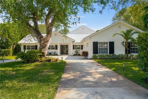 Discover this exceptional pool home in Central Beach! Just a stroll away from the beach, dining & entertainment. A canopy of mature oaks shades the driveway & landscape. Step into the bright foyer unveiling an open, expansive layout. Walls of windows...
