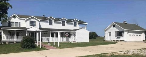 Stately hand crafted remodeled farm rests above its almost 80 acres. This 2 story full basement chateau is perfect for those that like a sprawling home with 10' ceilings; grand oak staircase and vast rooms; carriage house along with a 5 year VRBO ren...