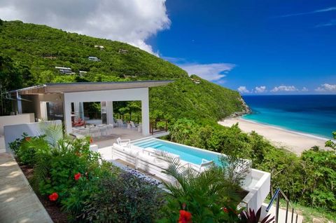 Introducing Villa Ventana, nestled along the pristine shores of Trunk Bay, Tortola. Coldwell Banker Real Estate BVI proudly presents this exceptional contemporary residence. Situated mere steps from one of Tortola's most breathtaking beaches, Villa V...