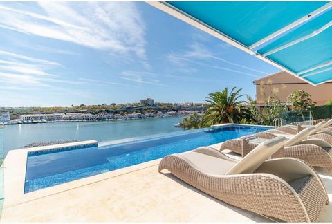 Spectacular design villa with fantastic views of the Port of Mahón with the latest demotic technology and luxury finishes. On the ground floor there is a double garage and the elevator that serves all levels of the house. On the first floor we find t...