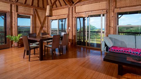 Beautiful ocean and mountain views. Unique tropical-feel Bamboo house in a very quiet, peaceful, and private location in Papohaku Ranchlands with a spacious carport and enclosed workshop/storage area. Views from every window in the house. Weatherproo...