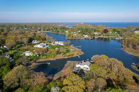 Magnificent waterfront Nantucket-style Colonial situated on 1.73 acres with private dock just two years young! This exquisite light filled 6 bedroom, 5 bathroom home boasts stunning water views in every room. The open floor plan, high ceilings and fl...
