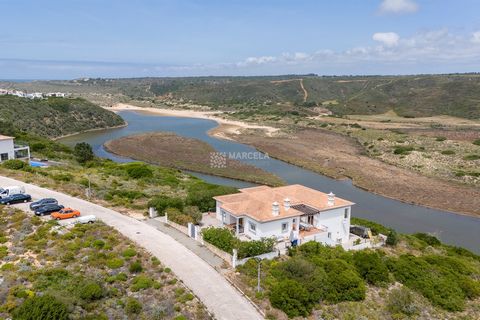 Located in Aljezur. A beautifully restored two storey 287m2 two bedroom villa located on a 680m2 plot on the frontline in Espartal with fabulous uninterrupted views over the Amoreira Valley within walking distance to the two local beaches at Monte Cl...