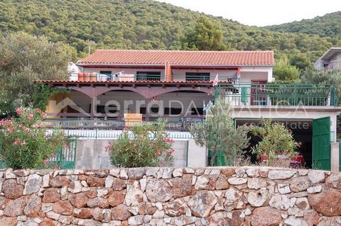 A house with potential is for sale in Grebastica near Sibenik, first row to the sea. It is located in a bay, next to a small pebble beach. The house consists of two one bedroom apartments, two two bedroom apartments and a garage. Given its exceptiona...