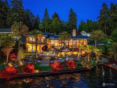 Resting on the edge of Lake Washington's serene banks, this Roland Terry sanctuary boasts 86+ feet of pristine no bank waterfront with grandfathered setbacks and lake irrigation system that waters the 29,000+ sq ft property. The main level features f...