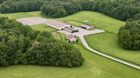 Welcome to 1701 Cooper Ridge Road, a serene 88-acre equestrian estate nestled in the picturesque countryside of Columbia, Kentucky. This meticulously maintained property offers a harmonious blend of modern amenities and rustic charm, making it an ide...