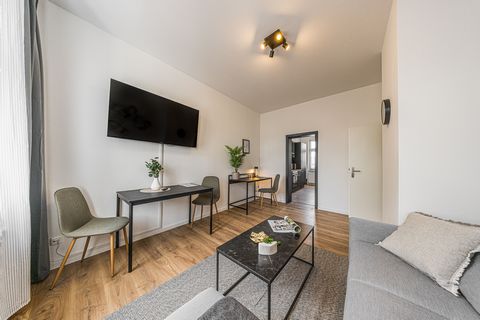 As you enter the apartment, you are greeted by a bright and airy living room with plenty of natural light. The style of the apartment is in soft grey tones, and the furniture are designed in a Scandinavian style with clean lines and minimalistic deta...