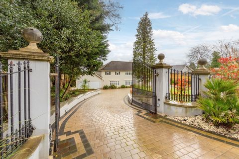 On the ground floor, there is a welcoming entrance hall, a well-equipped kitchen with dining area overlooking the garden, utility room, formal dining room, children’s playroom, additional living room with a bar, study, guest cloakroom, and an impress...