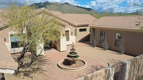 Motivated Seller - Price Reduction!!! Discover the enchanting allure of this expansive 5-bedroom, 4-bath desert oasis resting on nearly an acre lot with big beautiful mountain views. Delight in the grandeur of the oversized guest house with a private...