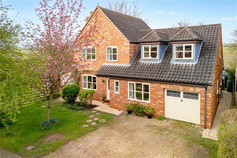 A delightful, 4 bedroom, quality home sits in a very quiet position overlooking fields with a south and west facing garden and a sizeable paddock adjoining, grounds totalling around half an acre. On the edge of the village of Potterhanworth about 7 m...