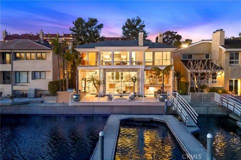 Newport Beach Waterfront Home with Private Yacht Dock. The property boasts a private boat dock that can accommodate three yachts up to 66 feet, ideal for boating enthusiasts. With 57 feet of water frontage, enjoy stunning views and a prestigious loca...