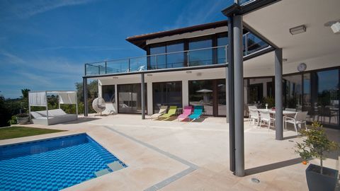 Stunning contemporary style front line golf villa enjoying sea and golf views from its pinnacle position. This stylish villa is perfect for entertaining, comprising on ground floor level of a large open plan,double height dining room/lounge with brea...