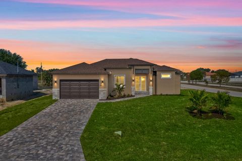 Discover the epitome of modern living in this captivating four-bedroom, two-bathroom residence nestled in the sought-after northwest Cape Coral area. (Also known as West of old burnt store road) Boasting sleek lines and contemporary finishes, this pr...