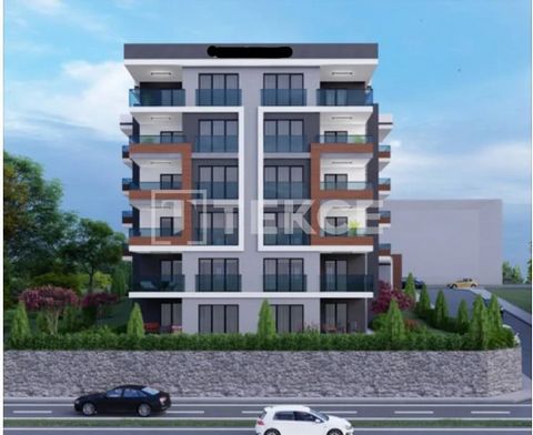 Apartamenty z widokiem na morze w pobliżu arterii w Besikduzu Trabzon. Nowo wybudowane apartamenty w spokojnej dzielnicy mieszkalnej w Trabzon Besikduzu oferują elegancki i atrakcyjny design. TZX-00243 Features: - Balcony - Lift - Satellite TV