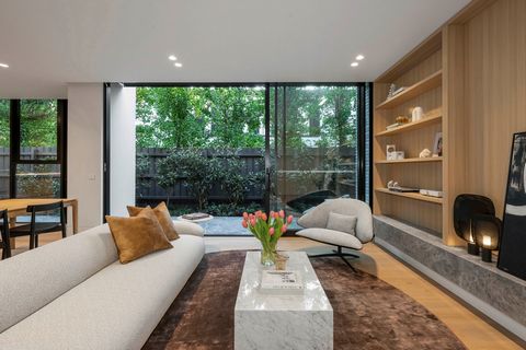 Welcome to 10 Devorgilla Avenue, where timeless elegance meets contemporary luxury. Crafted through meticulous collaboration between Cera Stribley Architecture, Jack Merlo Gardens, and Healey & Co Projects, this garden residence envelops you in refin...