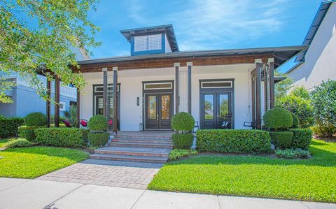 Discover luxury living in this exquisite one-story SMART HOME located in popular Laureate Park of Lake Nona. This ENERGY EFFICIENT SOLAR PANELED residence captivates with its stunning water view and park side tranquility, immediately welcoming you wi...