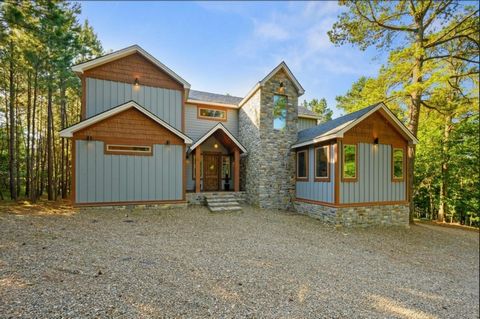 AS SEEN ON HGTV HOUSE HUNTERS! Copper Leaf Lodge is your long-awaited retreat nestled in the heart of Beaver's Bend. Immerse yourself in the charm of a master-planned luxury cabin community. Floor-to-ceiling windows flood the space with natural light...