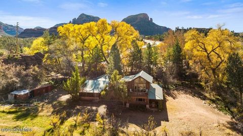 The jewel of Copper Cliffs... A Rare Landmark Sedona Estate on 2.53 acres with apple orchard in the heart of West Sedona! Short Term Rental Friendly! Great income potential! 5 Buildings on 2.53 acres. Plus roadside Farmstand w/grandfathered business ...