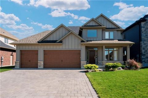 BACKING ONTO A CORNFIELD PLUS SHOP - Introducing a real gem in Mount Brydges' hottest neighbourhood Woods Edge â a jaw-dropping, 5-year-old, 4-bedroom custom-built home with a three-car garage and a slick drive-through. This place is the definition o...