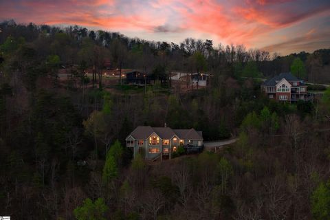 A quiet refuge nestled on-top of Paris Mountain featuring some of the most sensational views in The Upstate!! This entirely custom property features 4 bedrooms and 3 bathrooms alongside 2 private acres a-top Paris Mountain! Down the private drive you...