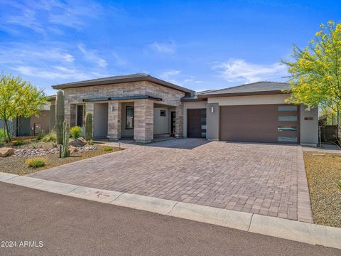 Refined bespoke luxury, this 2022 built soft contemporary designed residence is perfectly located in one of the valley's most scenic locations in the world class Trilogy community. This highly coveted Orion floor plan with rare 4th Bedroom Option and...
