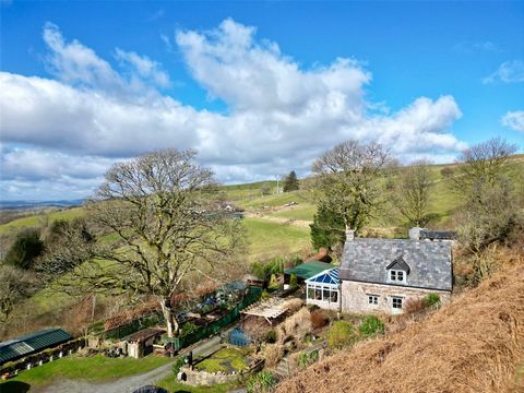 Perched in an elevated position with superb panoramic views, this quintessential two-bedroom cottage is a true countryside gem. Set within approximately 4 acres of beautifully maintained gardens and grounds, the property offers a rare opportunity to ...