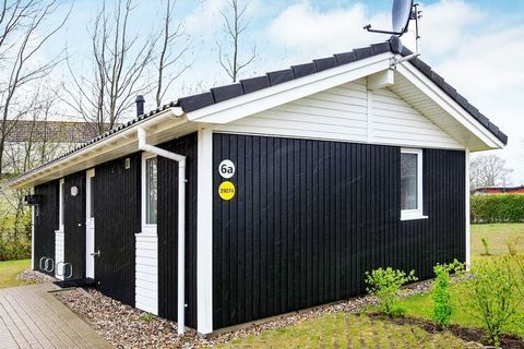 Bright and comfortable wooden holiday home built in Scandinavian style in OstseeStrandpark Grömitz in the holiday area Lensterstrand just outside Grömitz. The house is furnished with a well-equipped kitchen, which is in open connection with the livin...