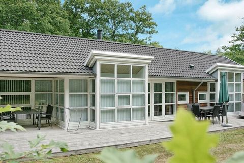Modern holiday cottage made from cedarwood, located in Hasle Lystskov with beautiful nature, only a few hundred metres from a fine sandy beach. The cottage has bright, modern Scandinavian furniture. Bright living room, cable TV with 12 channels (of w...