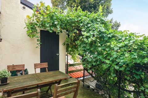 This is an idyllic town cottage in the old parts of Rudkøbing - built in 1890 and completely renovated in 2013. The old atmosphere has been preserved. The large bathroom on ground floor has a whirlpool for 2 people. On 1st floor there is a combined l...