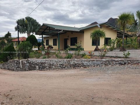 This cozy property located in Yunguilla’s valley, Cuenca-Ecuador has a total land constituting 7.41 acres (30000 meters), with two furnished houses. One house is 1076 sqft (100 meters) with 3 bedrooms 2 full bathrooms, kitchen with dining room, pool....