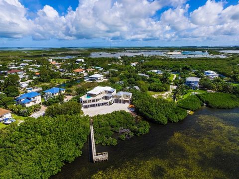 Welcome to your dream Florida Keys oasis! This stunning open water home is a luxurious waterfront retreat, offering the epitome of elegance and comfort. With 6 bedrooms and 6 bathrooms, this spacious estate is perfect for accommodating family and fri...