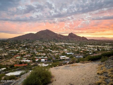 Experience this very rare view lot opportunity at the southern base of Mummy Mountain, centered on Iconic Camelback Mountain with views of the entire mountain and very rare Downtown Phoenix city lights! Fully approved and ready to pull permits for co...
