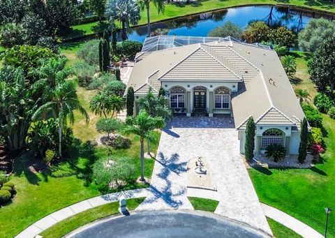 Experience the epitome of luxury living in this custom built 5-bedroom 4-bath magnificent lakefront masterpiece in the prestigious guard-gated golf community of Baytree. Superb location in serene cul-de-sac on nearly 1/2 acre pie-shaped lot for compl...