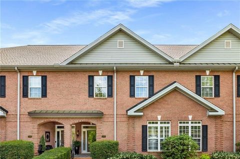 **SHOWINGS START FRIDAY, 4/12** An exquisite townhome, built entirely of brick featuring seasonal lake views, and direct Lake Lanier access via kayak/canoe right from your backdoor! As you enter the formal front entrance your eye will be drawn to a c...