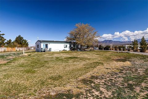 This 1.22 acre lot has an established septic and well on property. Currently there is a 1284sq ft 2 bedroom 1 bathroom mobile home that has nice landscaping all around including a garden. This lot has great potential and a Shed for storage.