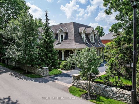 Nestled in one of Oakville's most prestigious neighborhoods, this impressive 5,600 square foot home offers a unique blend of tranquility and luxury just 600 meters from the shores of a beautiful lake. Surrounded by lush landscaping and facing south t...