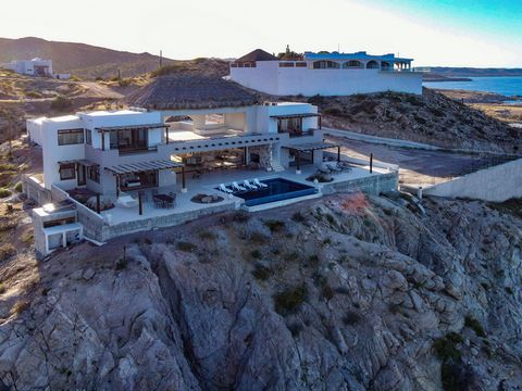With 200 steps down to the beach this new oceanfront home offers vast panoramic views of the Sea of Cortez inviting you to indulge in the ultimate coastal lifestyle. Boasting an infinity pool and four master bedrooms each with its own bathroom this o...