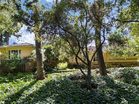 Sited on a landscaped knoll north of Huntington Drive, this single level traditional property was built in 1942 and maintains its original character and privacy. A gently meandering garden walk with broad tread flagstone steps provides a gradual appr...