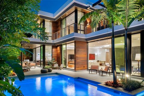 Stunning, new construction tropical modern home on a serene street in coveted North Coconut Grove, offers 7,146 SF adj of luxury living. Designed by renowned architect Charles Treister, the 6-BD, 7-BA, 2-half BA home is set on the coastal ridge 18 FT...