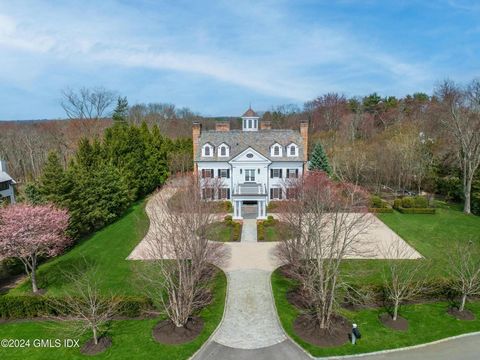 Majestic Richard Granoff-designed stone and clapboard Georgian home, nestled within 2+ landscaped acres on a private gated lane. This stone and clapboard masterpiece features beautifully scaled rooms across three light-filled floors, each boasting hi...